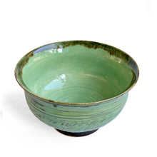 Green celadon glazed bowl with chattered pattern