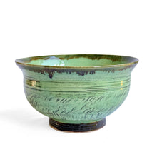 Green celadon glazed bowl with chattered pattern