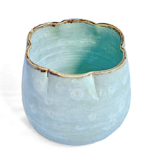 Turquoise blue celadon glazed scalloped edge pot with crystal bloom